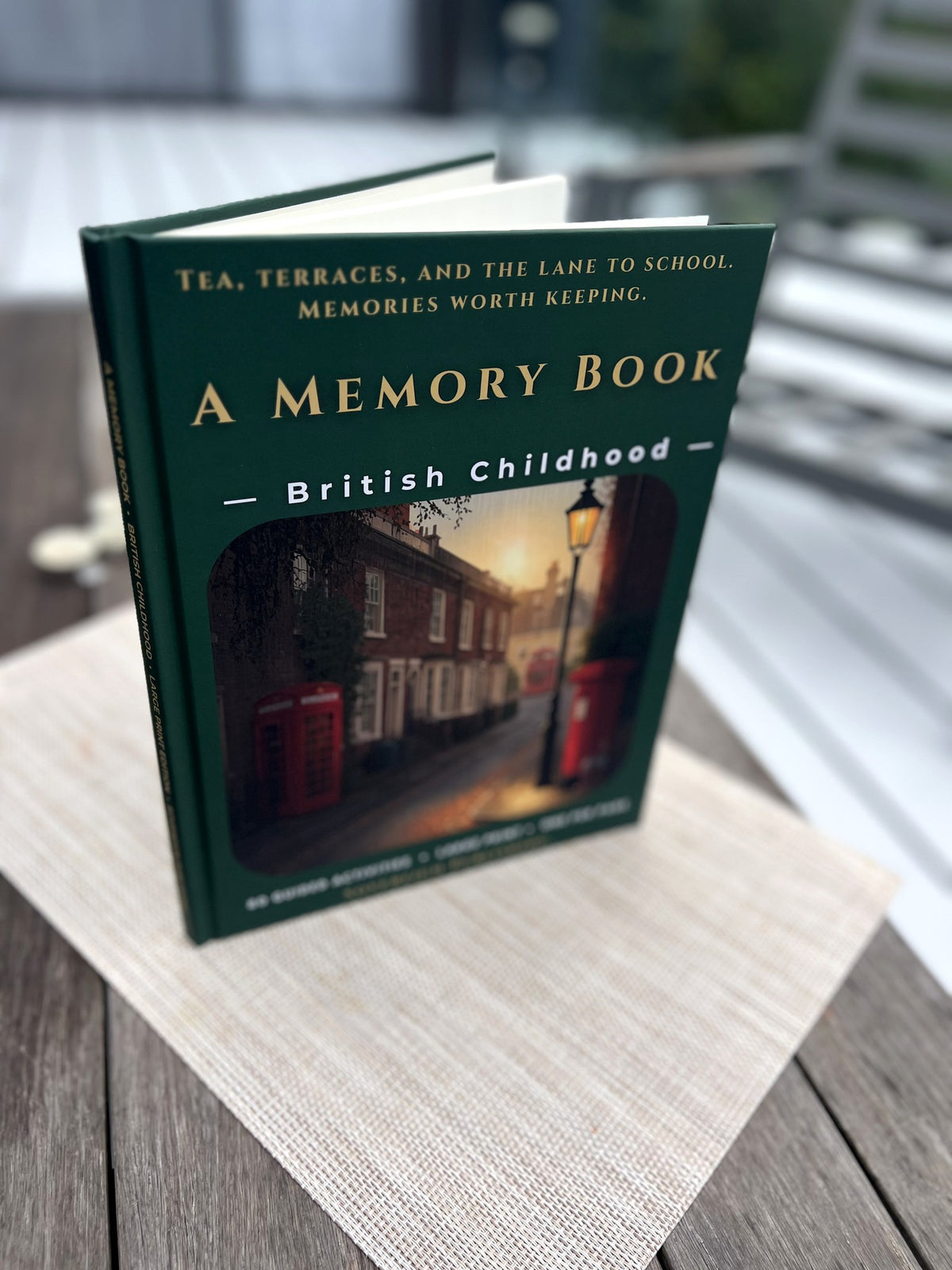 A Memory Book - British Childhood standing hardcover, photographed in the garden